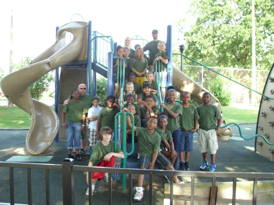 Group of kids and Officer at a Playground